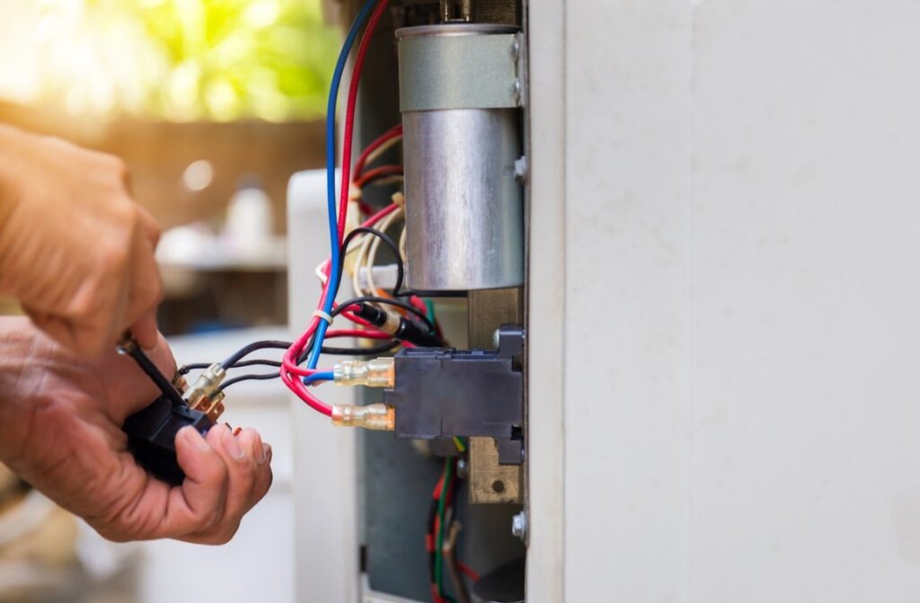 Technician repairing ac in Mayfield